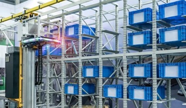 Warehouse Racking System with Robotic Equipment and Blue Storage Bins